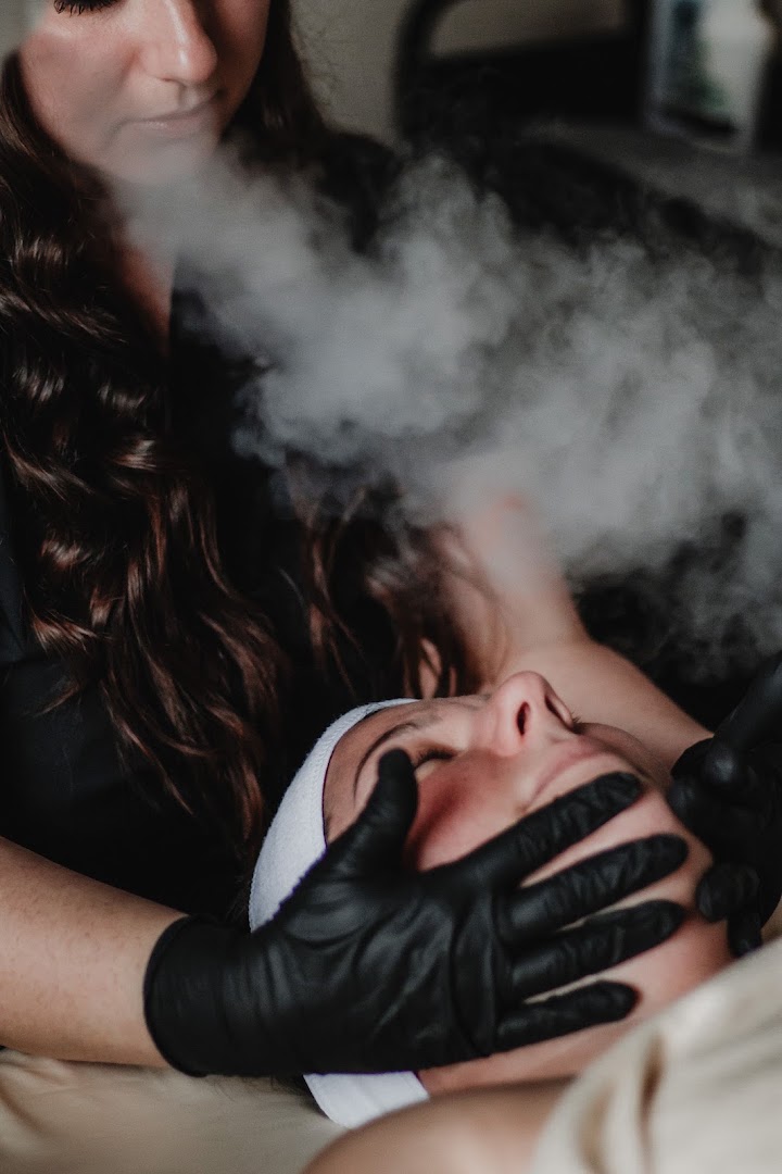 Warm steam opening pores during a customized facial treatment